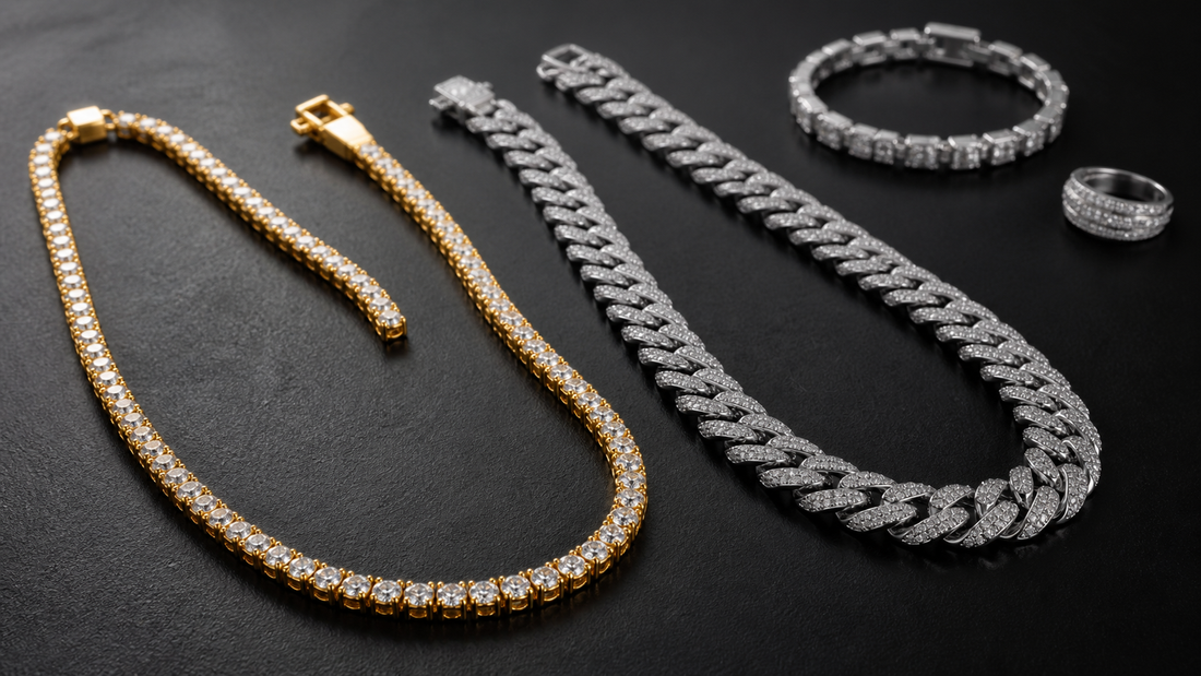 Gold tennis chain and silver Cuban link chain arranged on a dark surface for an iced jewelry buying guide