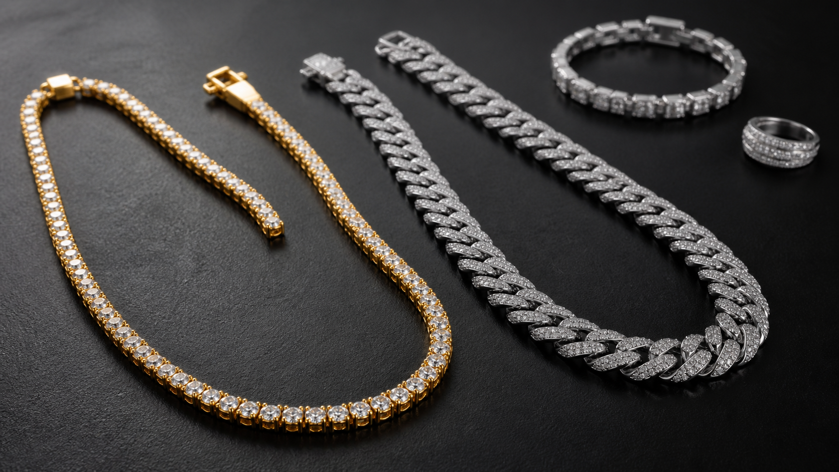 Gold tennis chain and silver Cuban link chain arranged on a dark surface for an iced jewelry buying guide