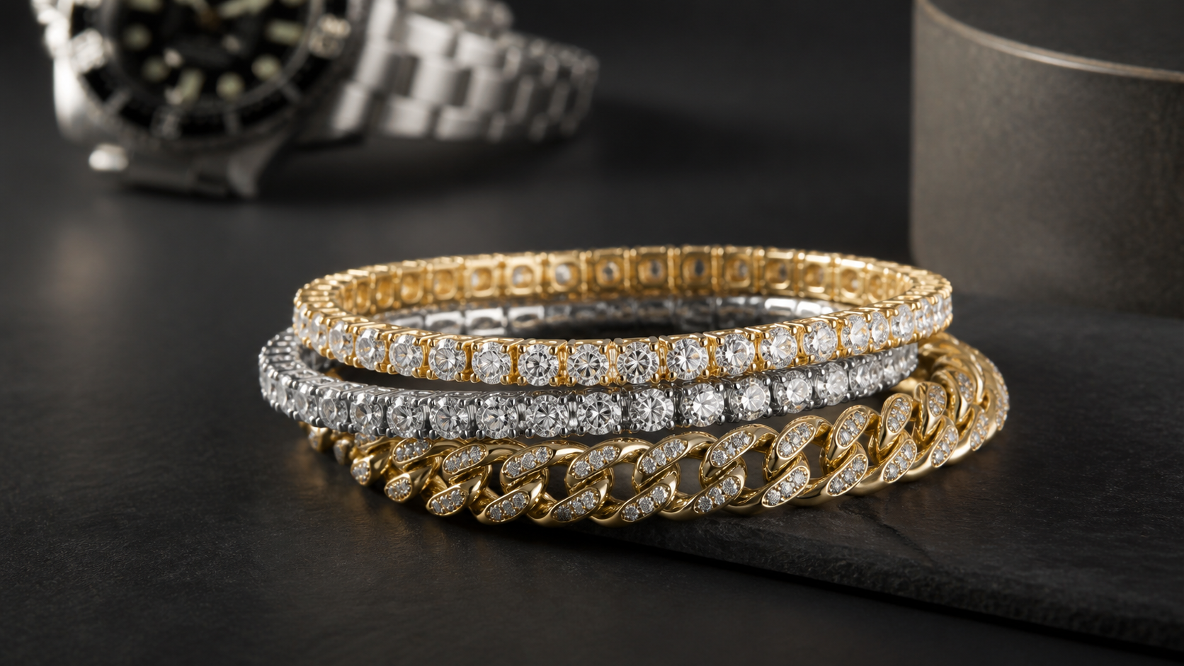 Stacked gold and silver iced bracelets on a dark tabletop