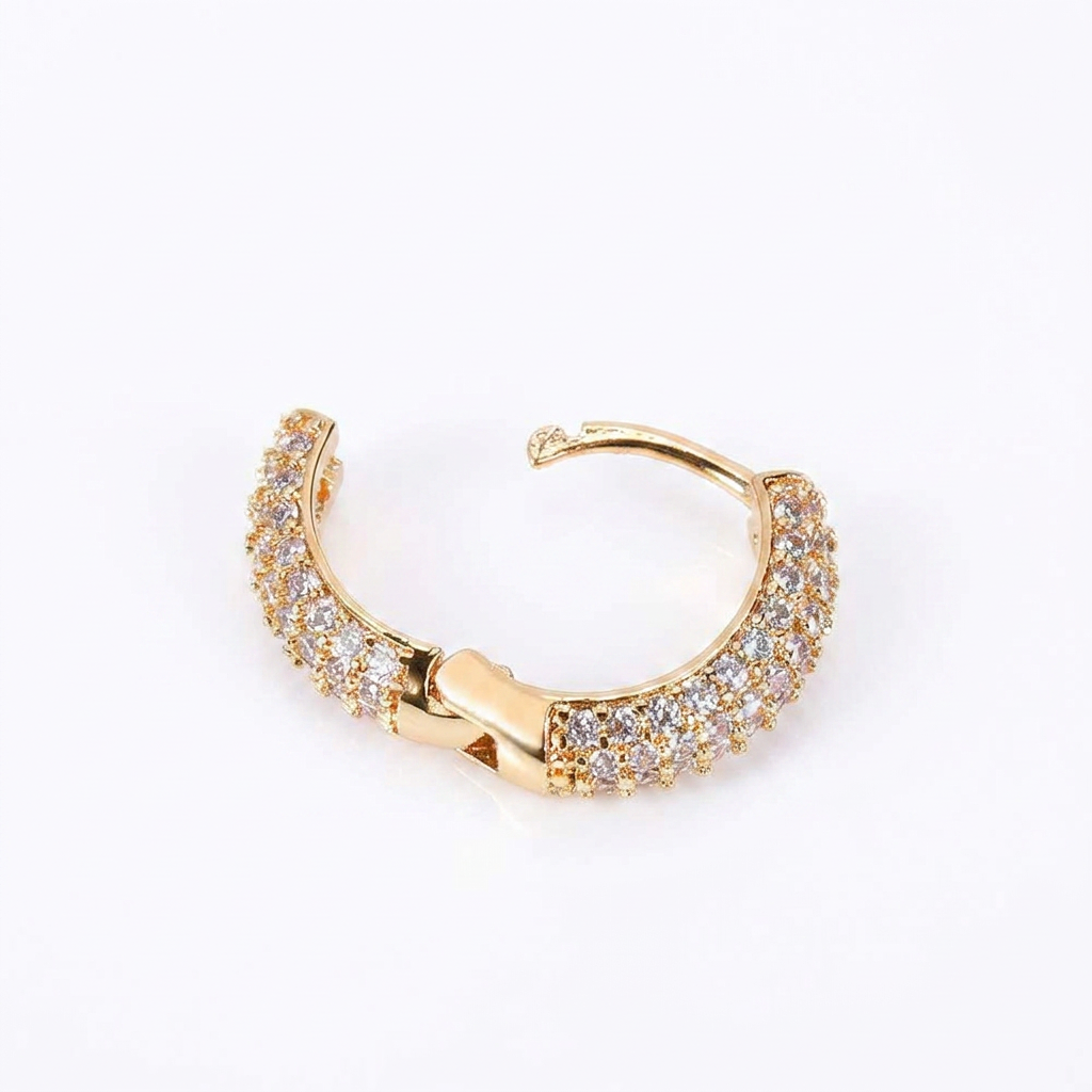Gold triple-row hoop earring with iced CZ stone detailing