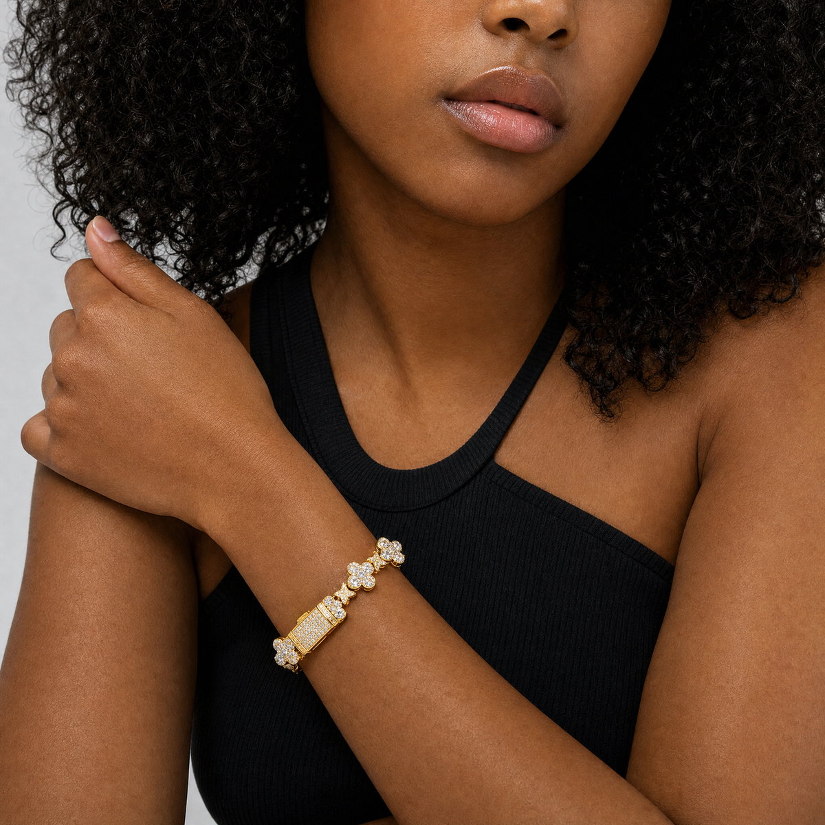 Gold plated Iced Clover Cross Bracelet worn by a female model